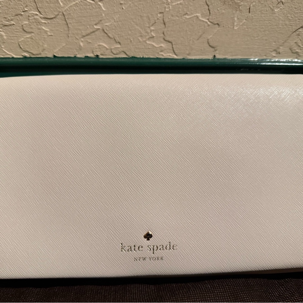 Kate Spade White Wristlet with Minimalist Design